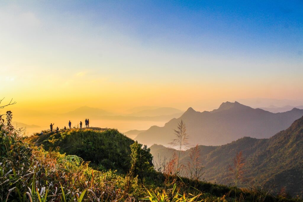 listings photo of people standing on top of mountain near grasses 733162.jpg